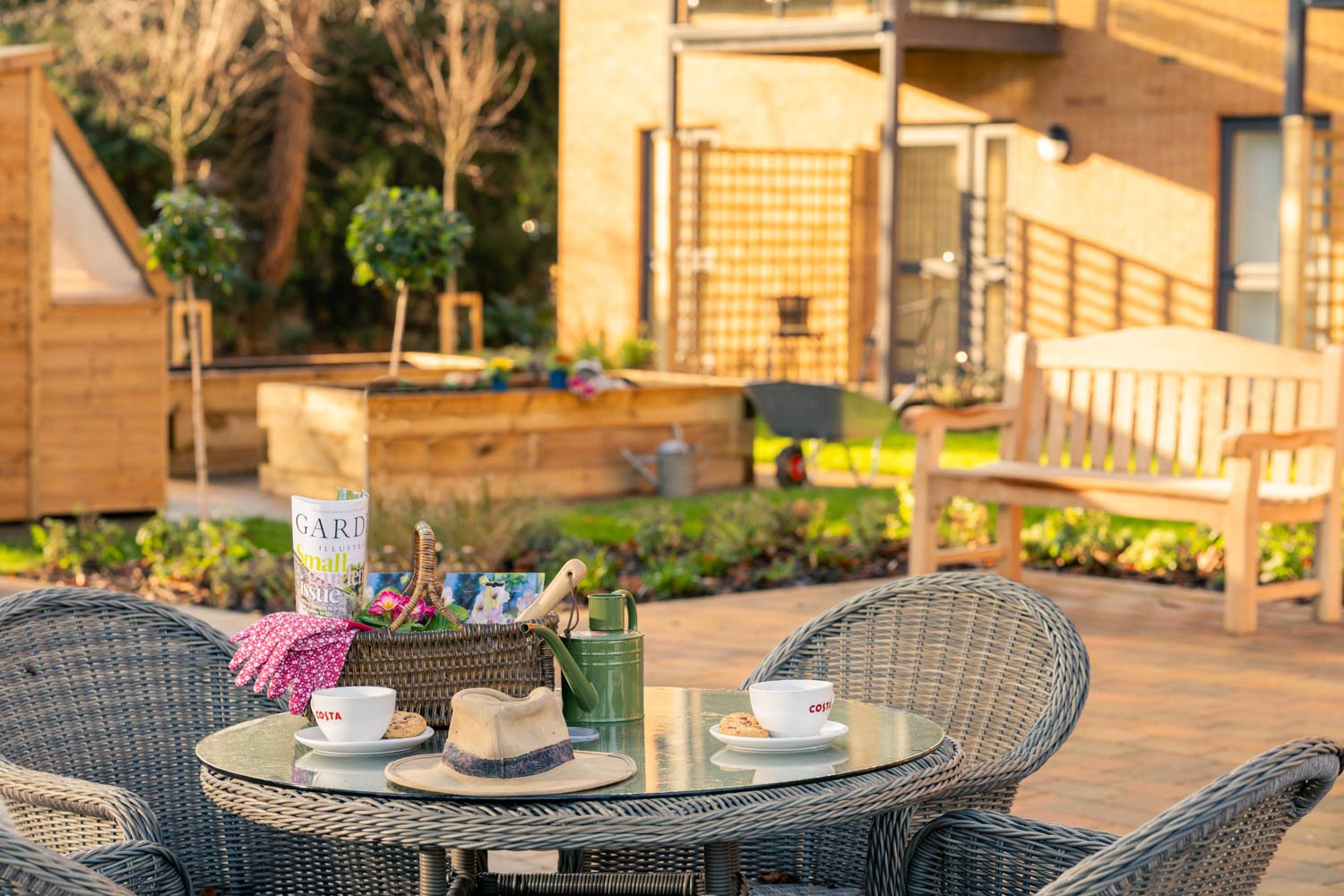 a table with a hat and cups on it outside