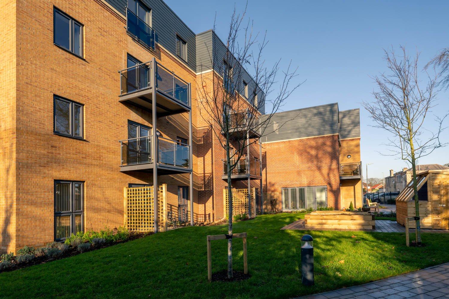a building with a green lawn
