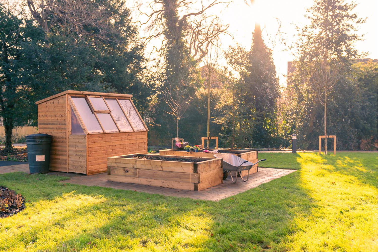 a small building with a bench in a park