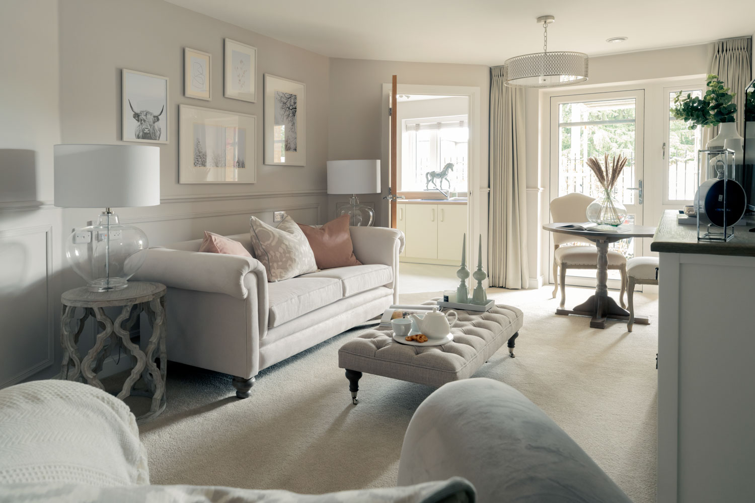a living room with a white couch and a table