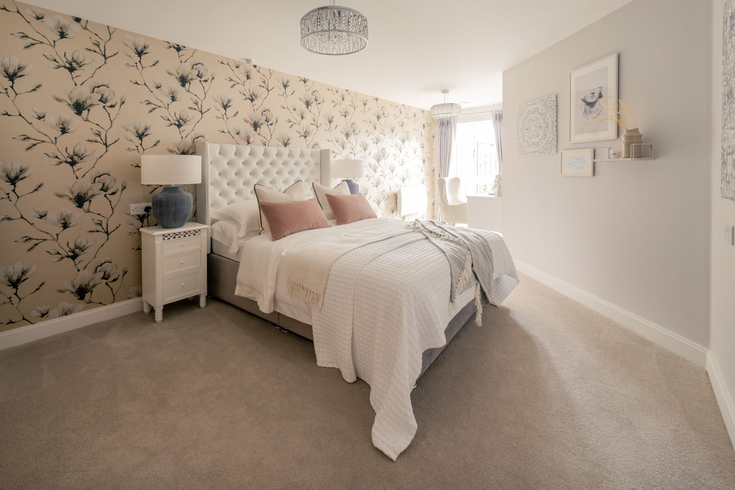 a bedroom with a bed and a lamp