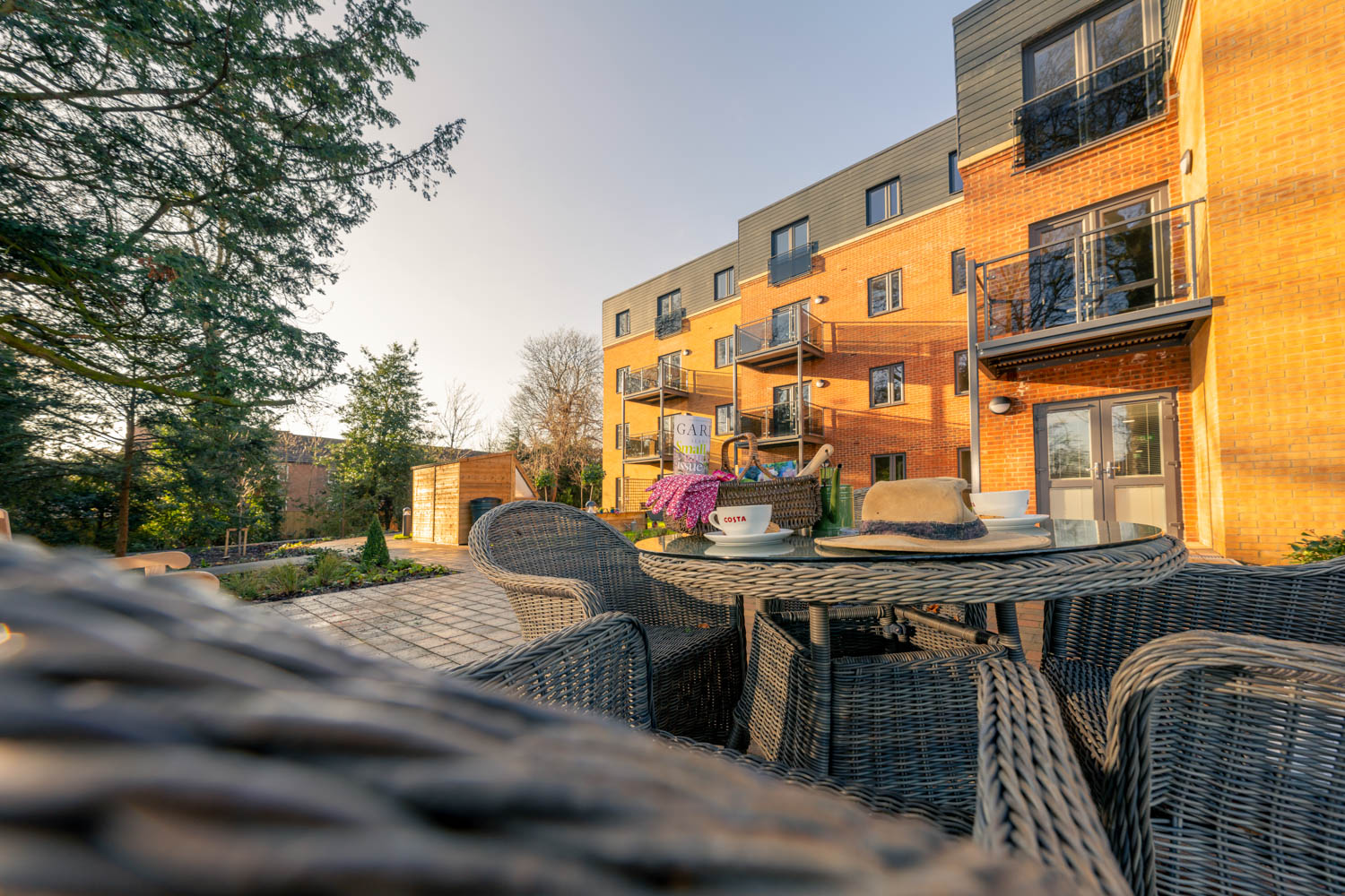 a patio with chairs and tables outside