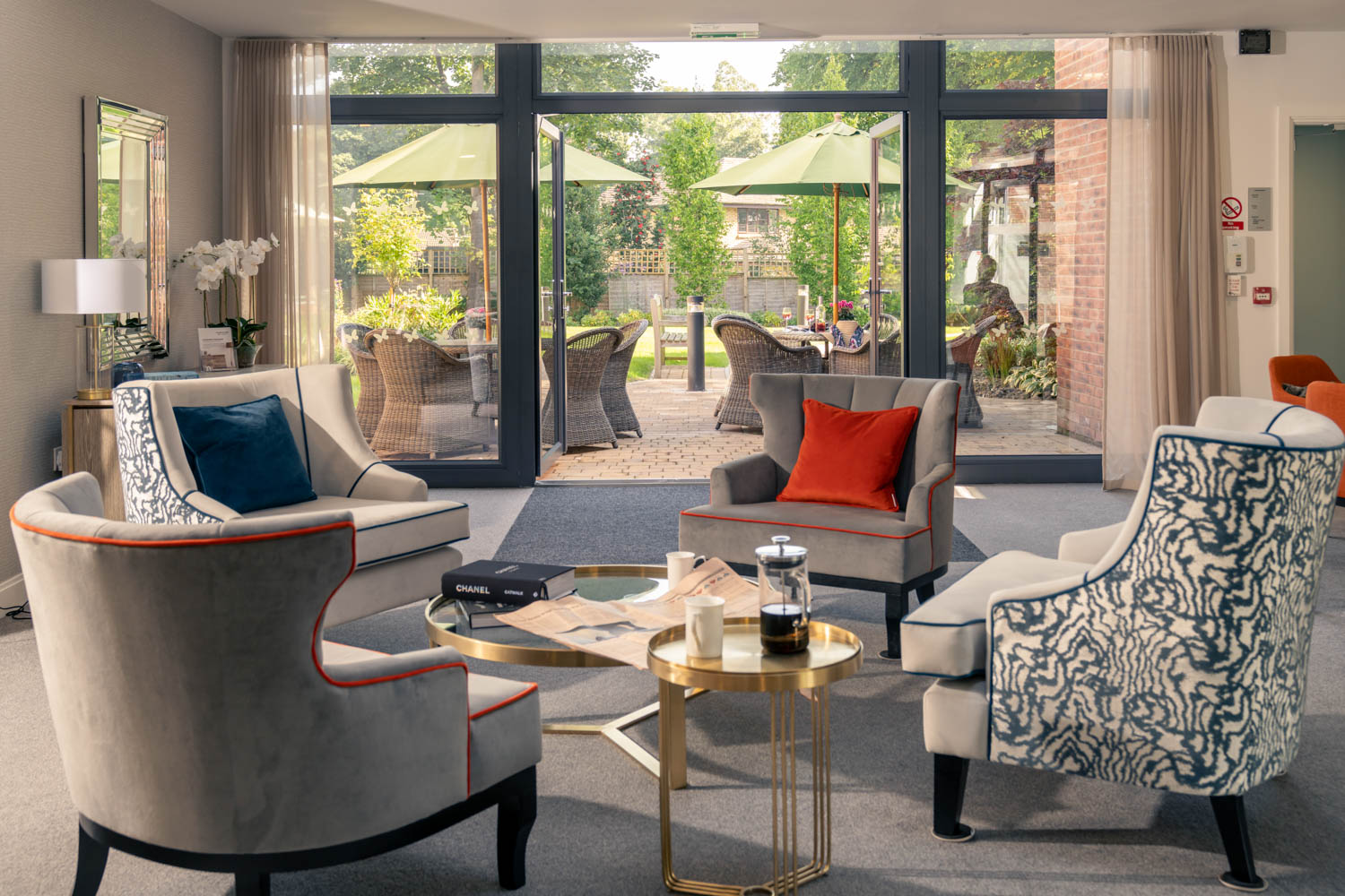 a living room with a table and chairs