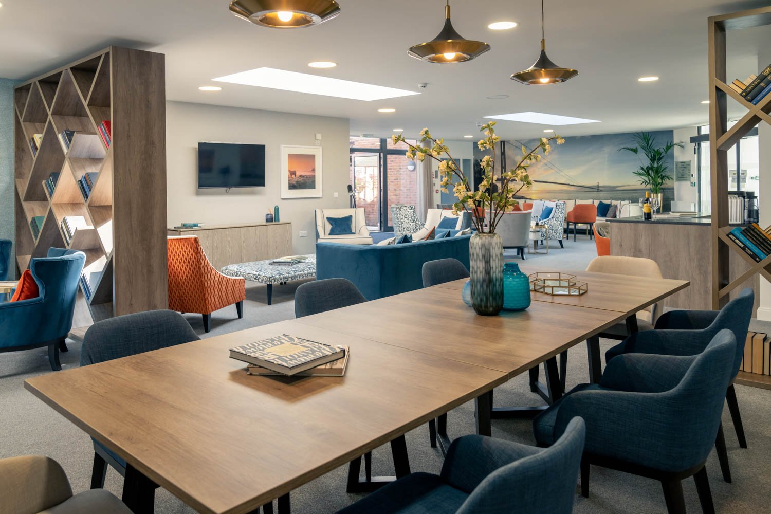 a large room with a table and chairs