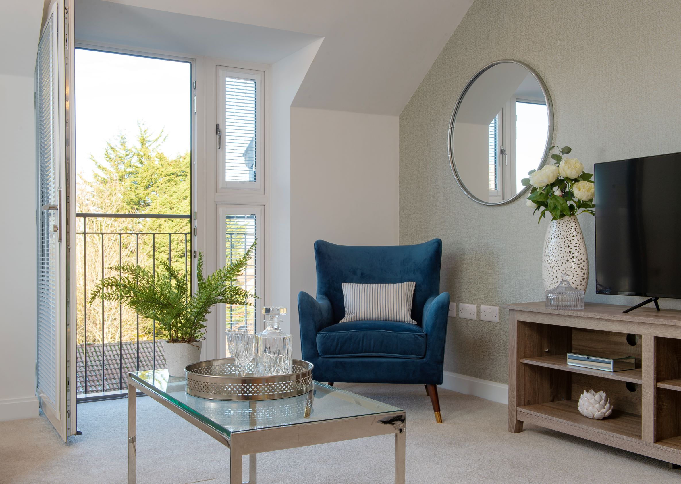 a living room with a blue chair
