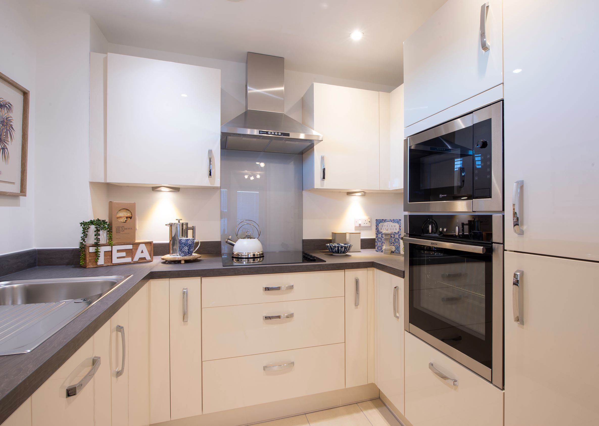 a kitchen with white cabinets