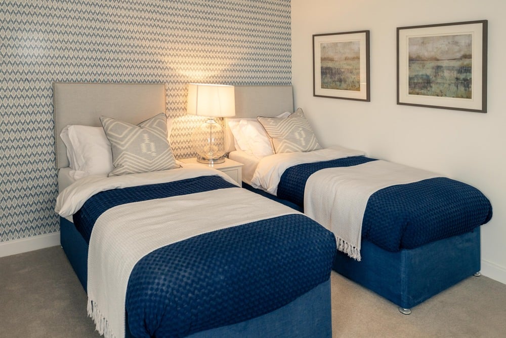 a couple of beds in a hotel room