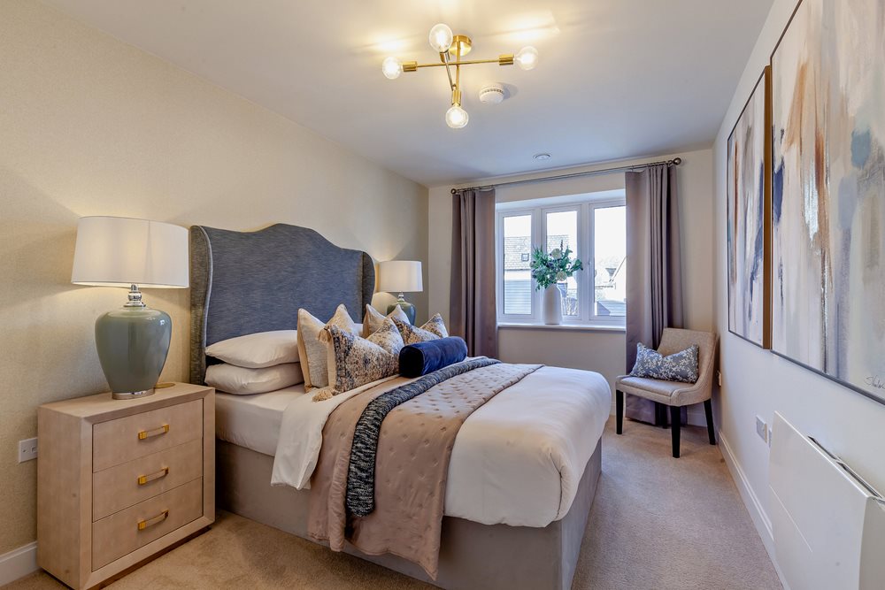 a bedroom with a bed and a chair