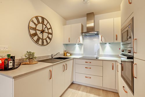 a kitchen with white cabinets
