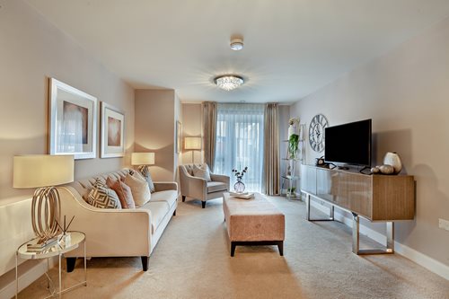 a living room with a tv and couches