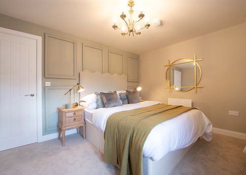 a bedroom with a large mirror