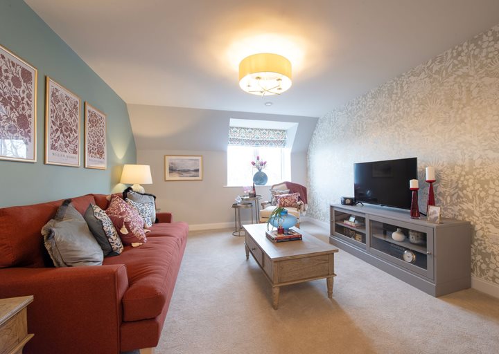 a living room with a couch and a tv