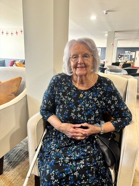 an old woman sitting in a chair