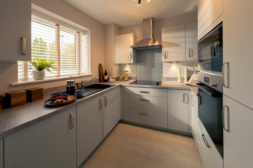 a kitchen with white cabinets