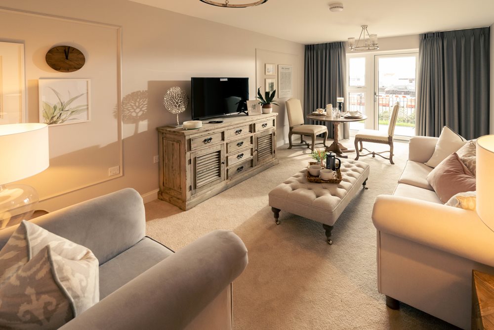 a living room with a tv and couches