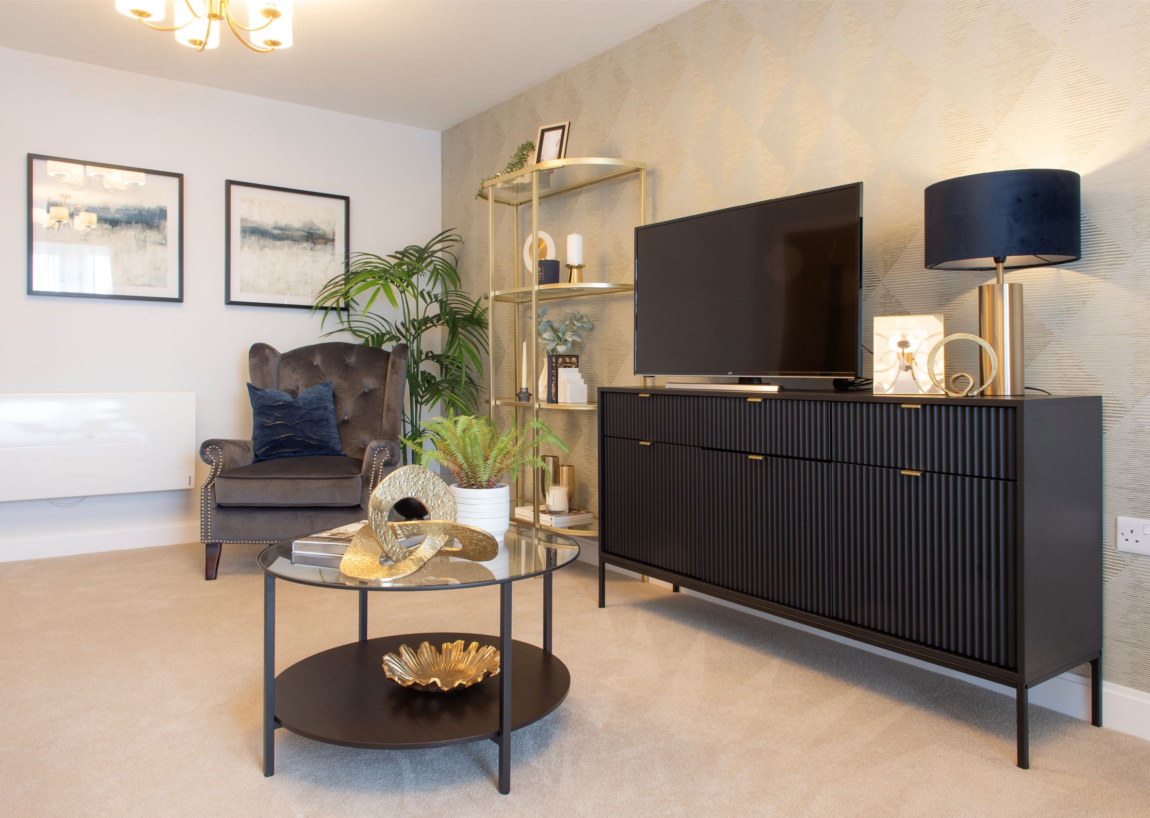 a living room with a tv and furniture