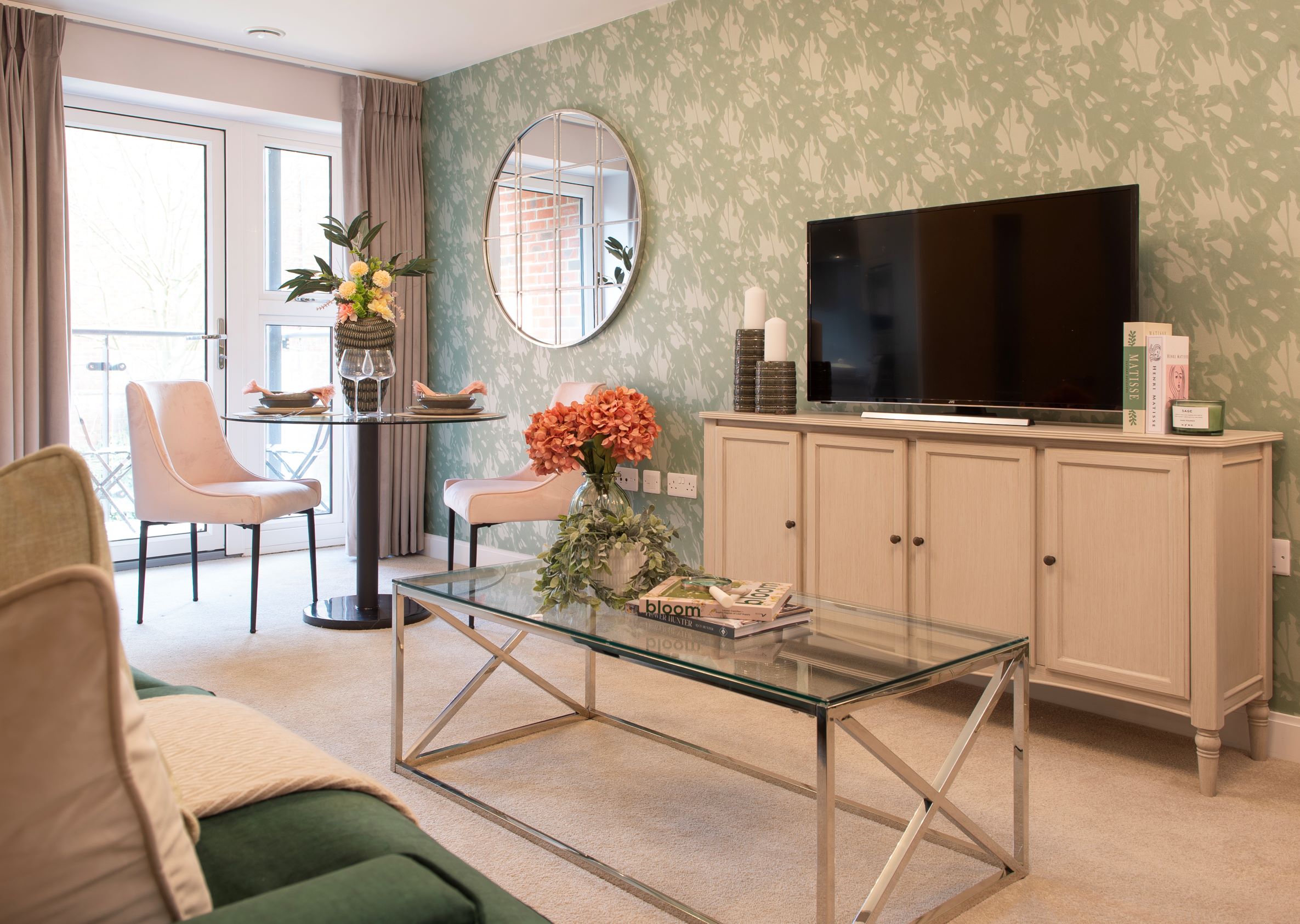 a living room with a tv and a table