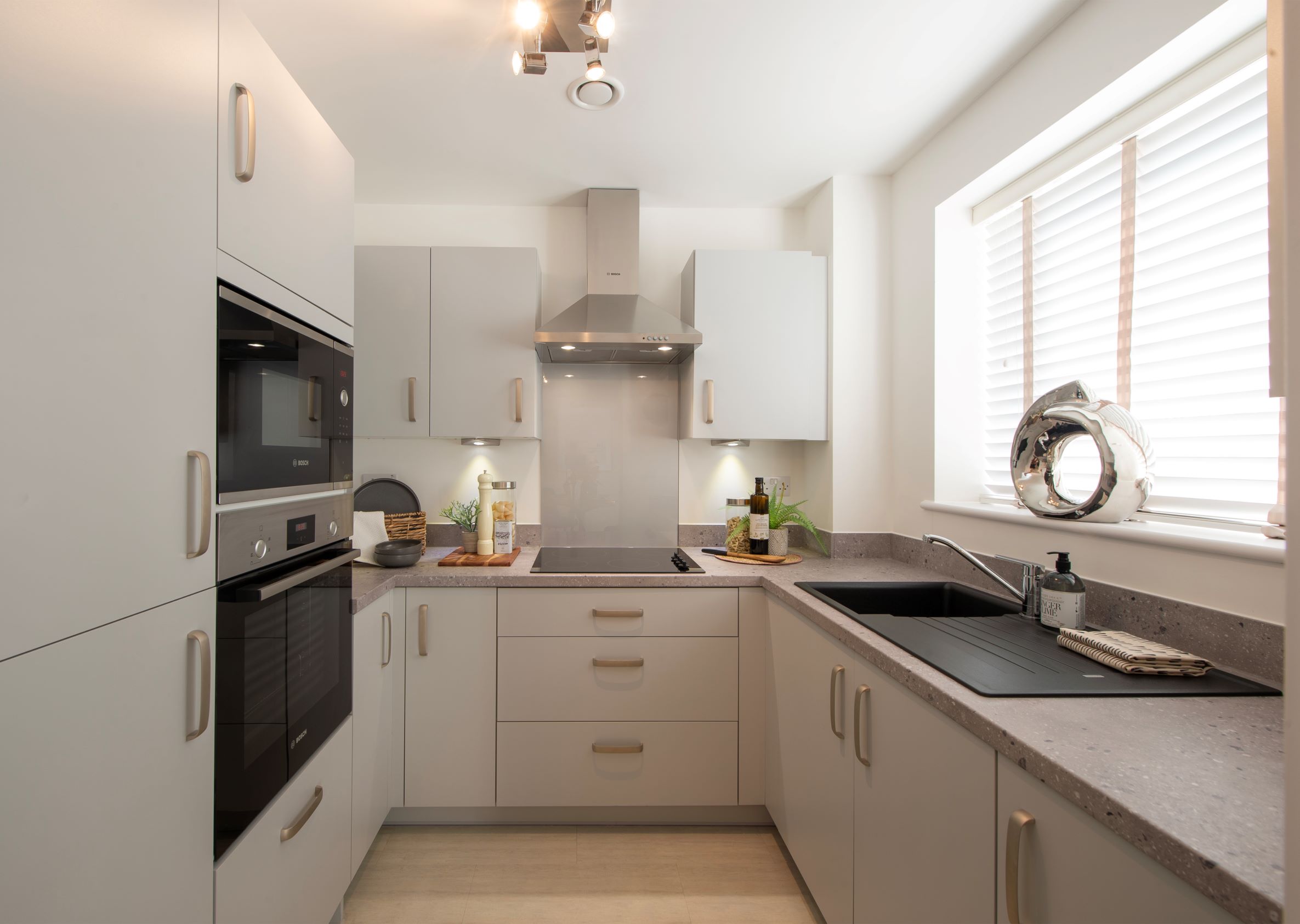 a kitchen with white cabinets