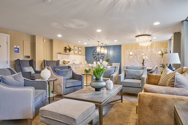 a living room with a large chandelier and a couch