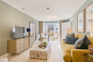 a living room with a tv and couches