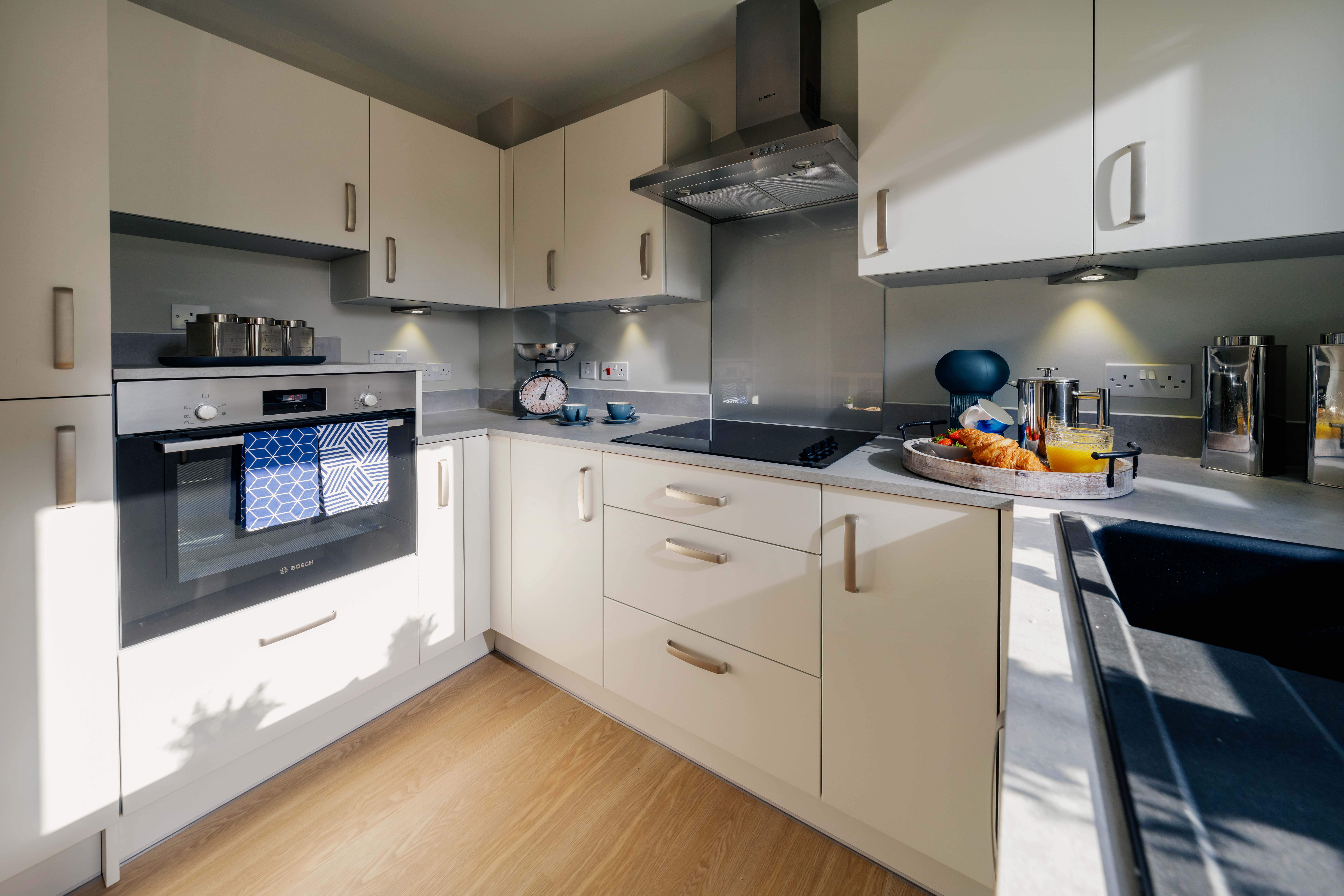 a kitchen with white cabinets