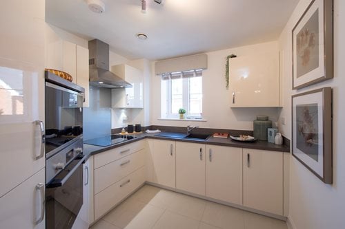 a kitchen with white cabinets