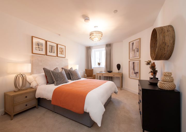 a bedroom with a bed and a table