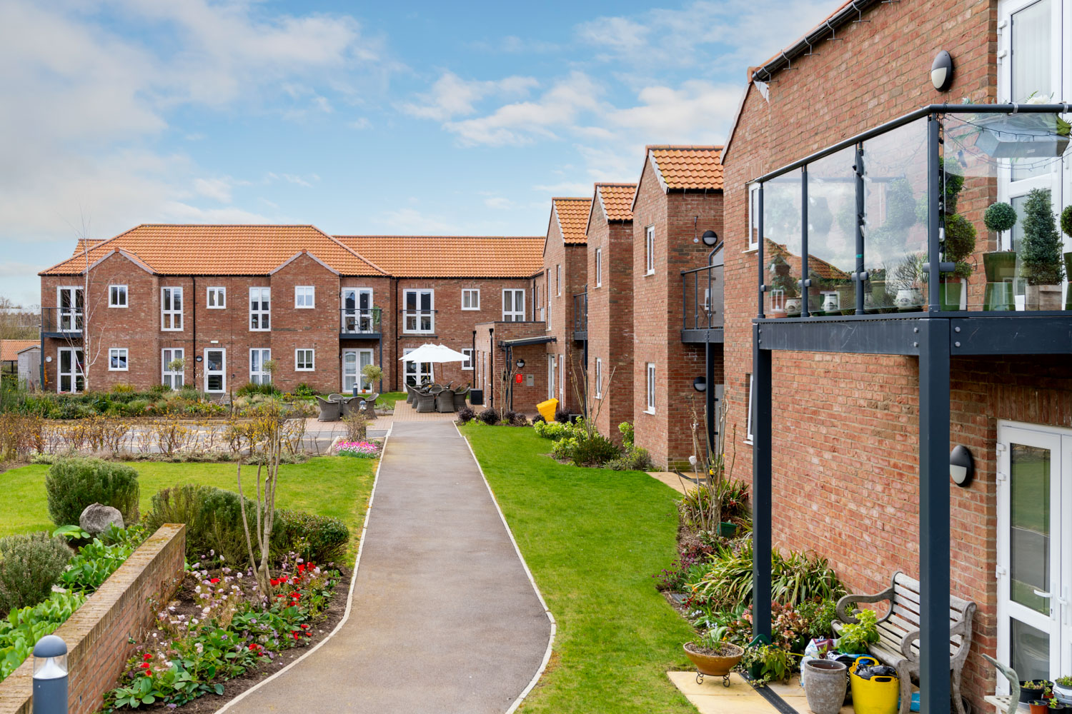 a brick building with a garden