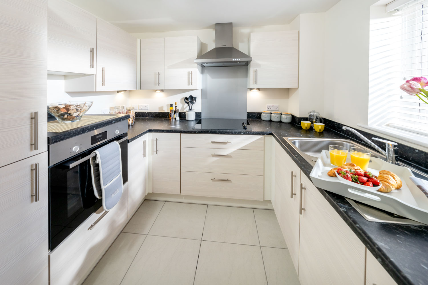 a kitchen with white cabinets