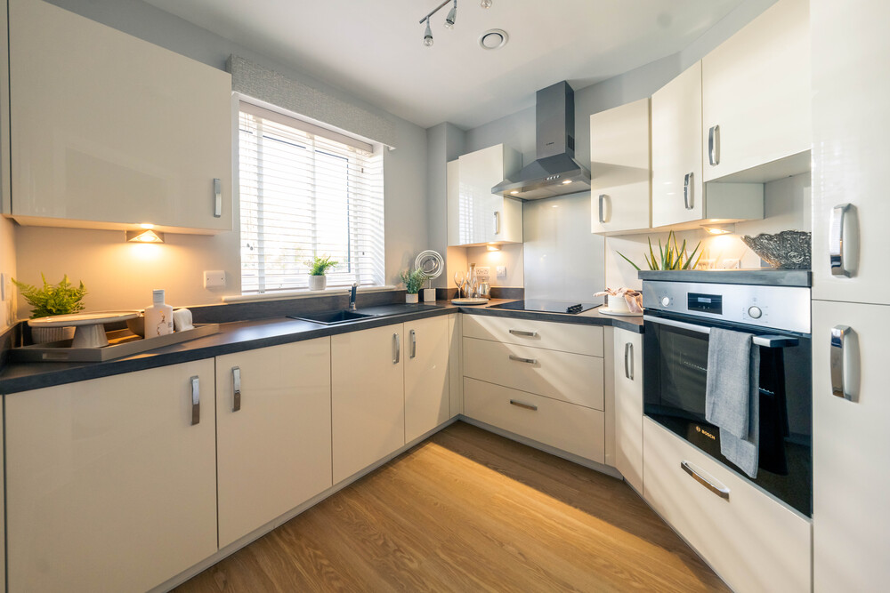 a kitchen with white cabinets