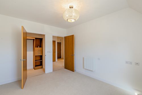 a hallway with doors and a light