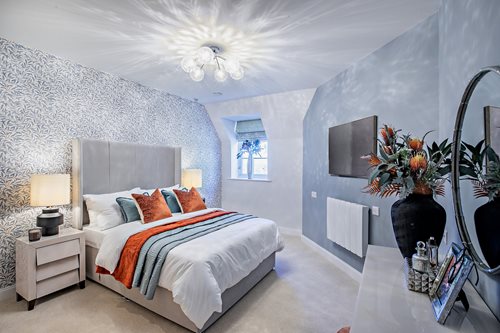 a bedroom with a bed and a mirror
