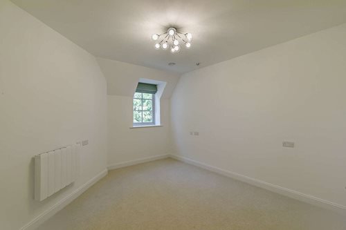 a room with a light on the ceiling