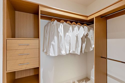 a closet with clothes