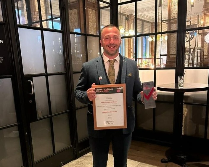 a person holding a certificate