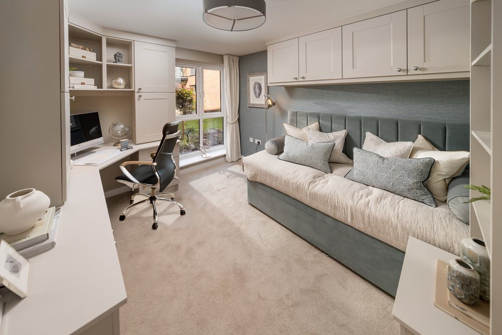 a room with a couch and a desk