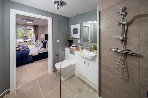 a bathroom with a shower and sink