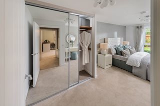 a bedroom with a glass door