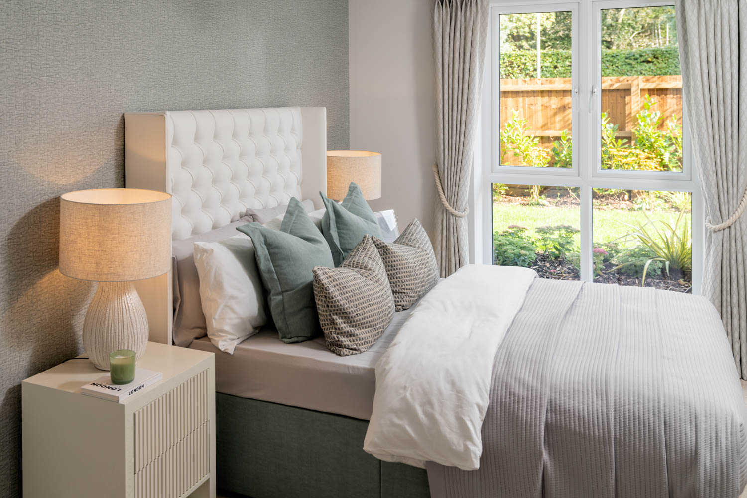 a bed with white pillows