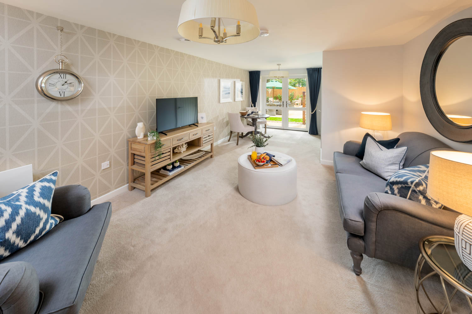 a living room with a tv and couches