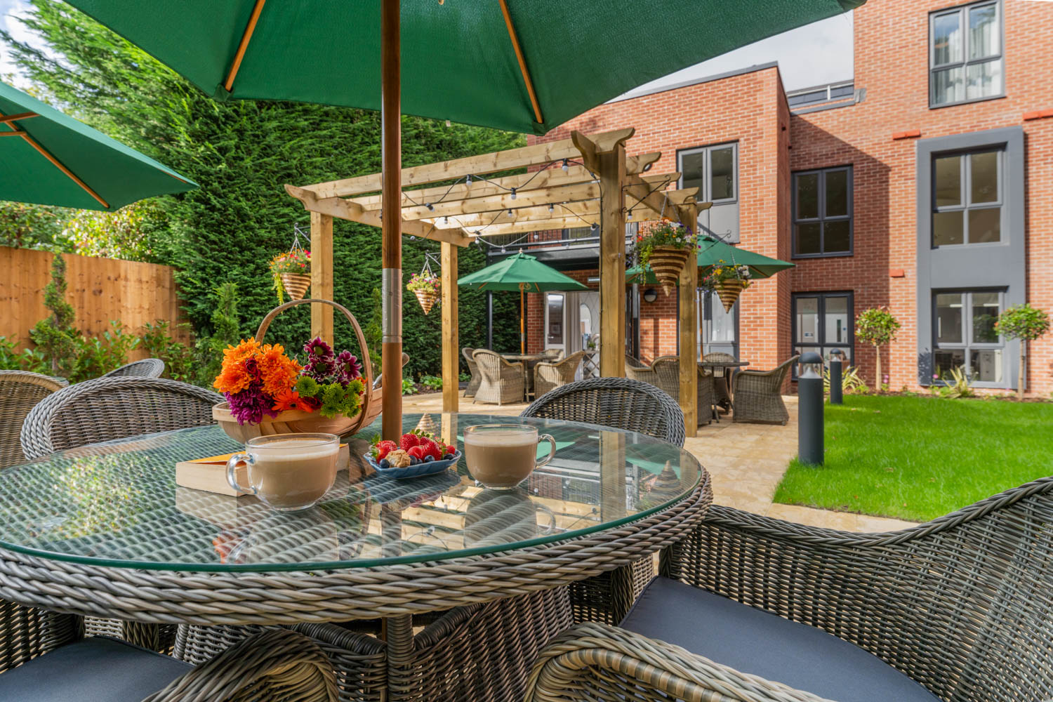 a table with a flower pot and umbrella on it