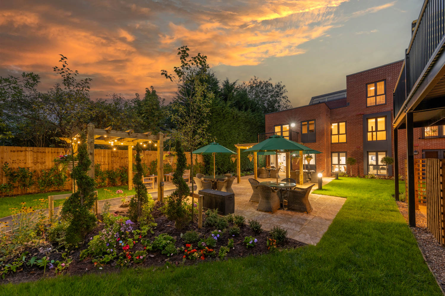 a backyard with a fountain and a garden