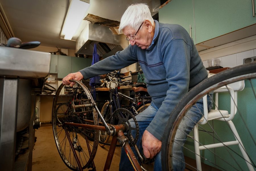 a man fixing a bicycle