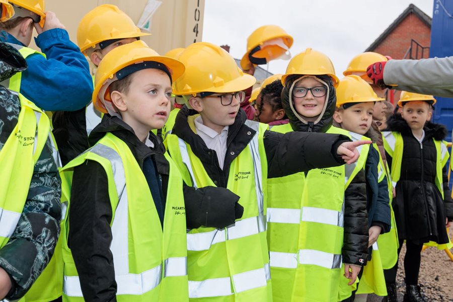 a group of people wearing yellow and green jackets