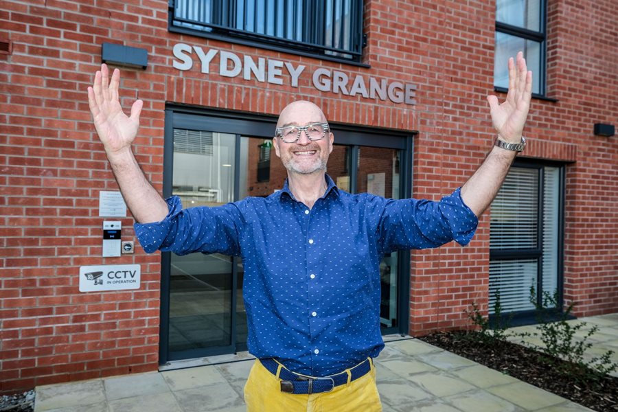a man with his hands up