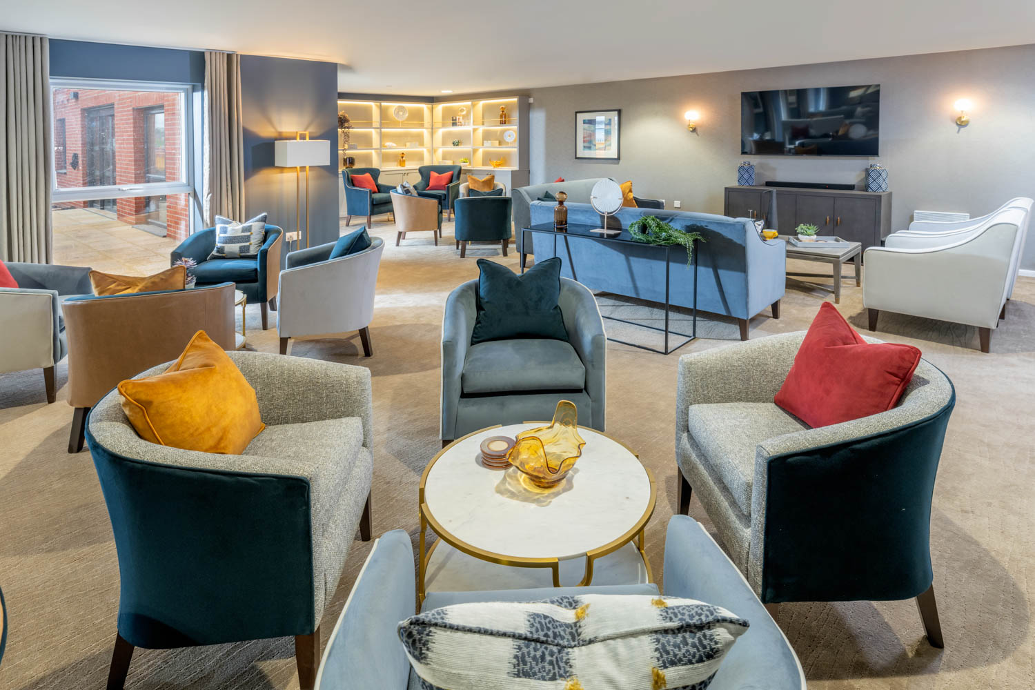 a room with a couch and chairs