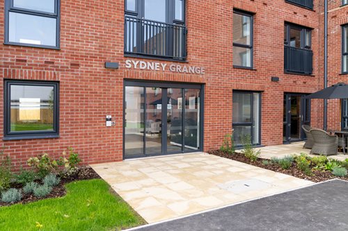 a brick building with a glass door