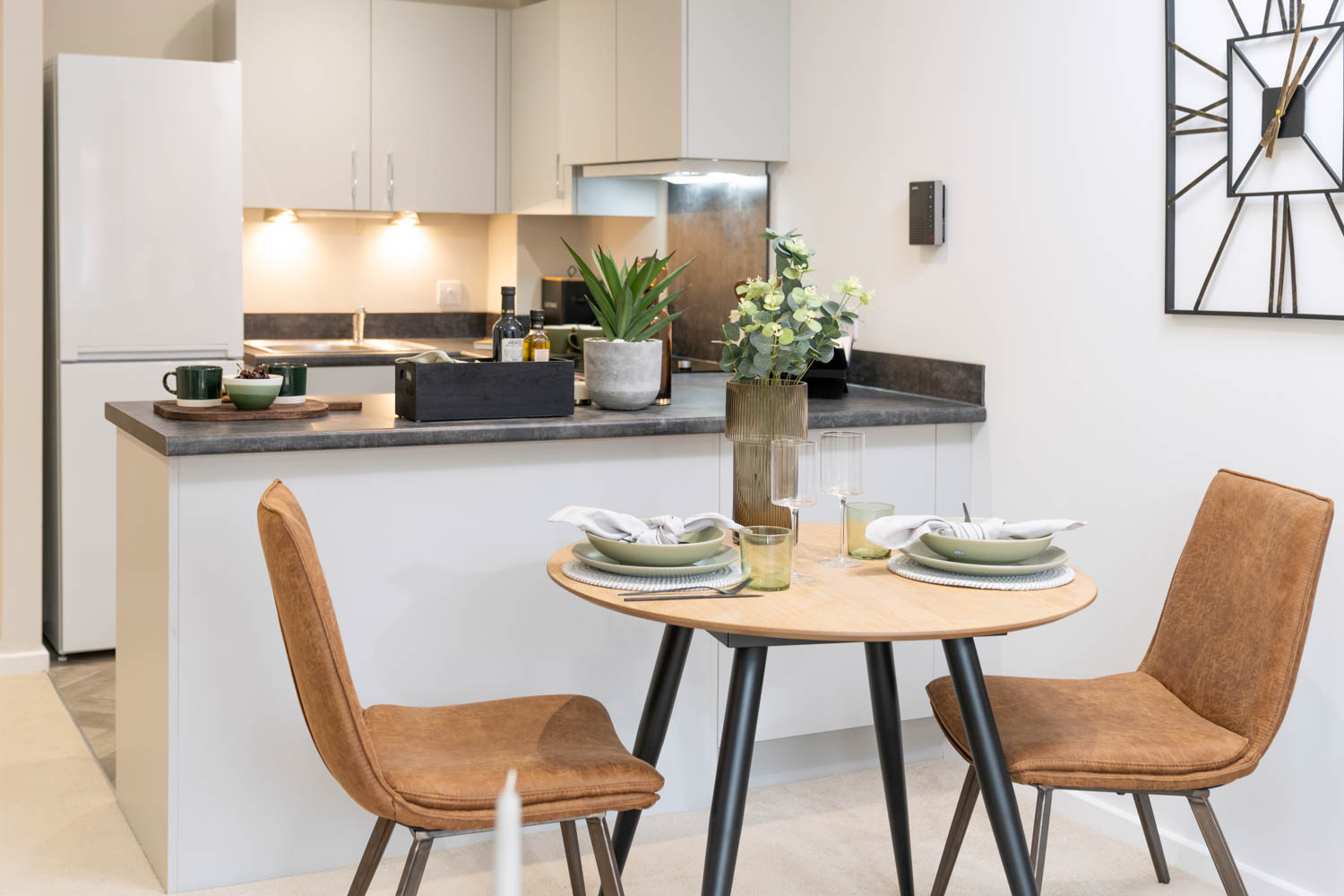 a kitchen with a table and chairs