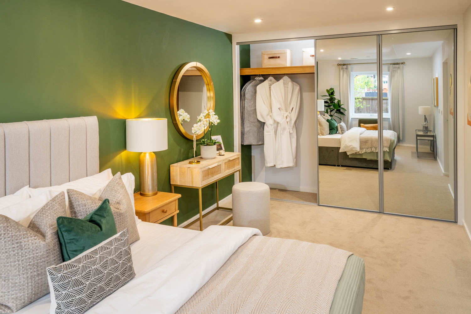 a bedroom with a large mirror