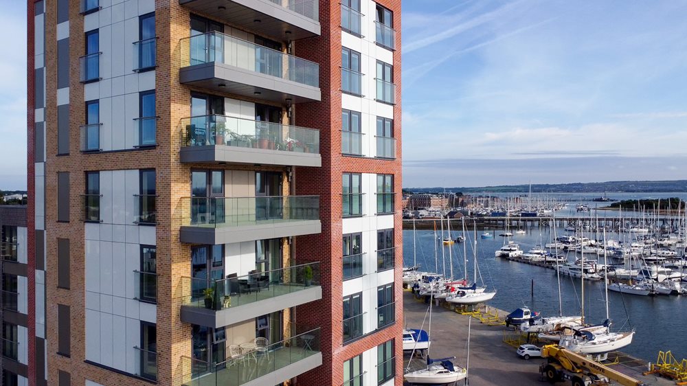 a building next to a body of water